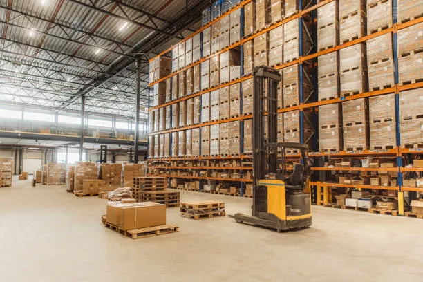 Forklift in a large, well-organised warehouse